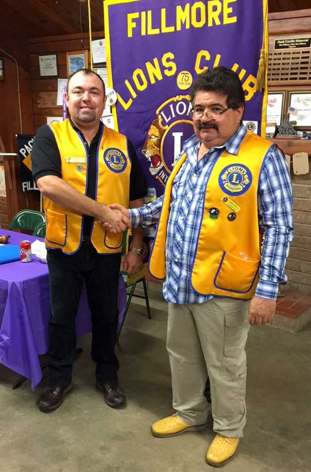 The Fillmore Lions Club has added a new member with the induction of German Cea. Fillmore Club President Eddie Barajas (right) congratulates Cea during induction ceremonies at a recent meeting. In addition to his name tag Cea was also presented with a Lions’ vest. Photo courtesy Brain Wilson.