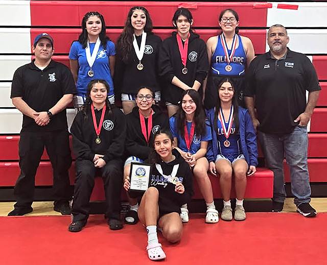 On Saturday, February 7, the FHS Girls wrestling team competed at the Citrus Coast League Wrestling Finals at Hueneme High School with three athletes earning league titles and multiple wrestlers placing overall. Pictured top standing left to right is Coach Michael Torres, Michelle Pinedo, Skyla Sandoval, Delilah Cervantez, Sophia Rivera, Coach Jorge Bonilla, middle sitting: Tania Vazquez, Sofia Montelongo, Alani Alvarado, Aubree Herrera, kneeling: Naomi Bonilla. Not pictured: Sophia Valdovinos and Annabelle Olaguez. Photo credit Lurdes Bonilla.