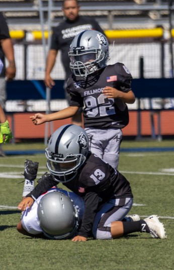 Fillmore Might Mites Black taking down a Valley Rush player last Saturday.