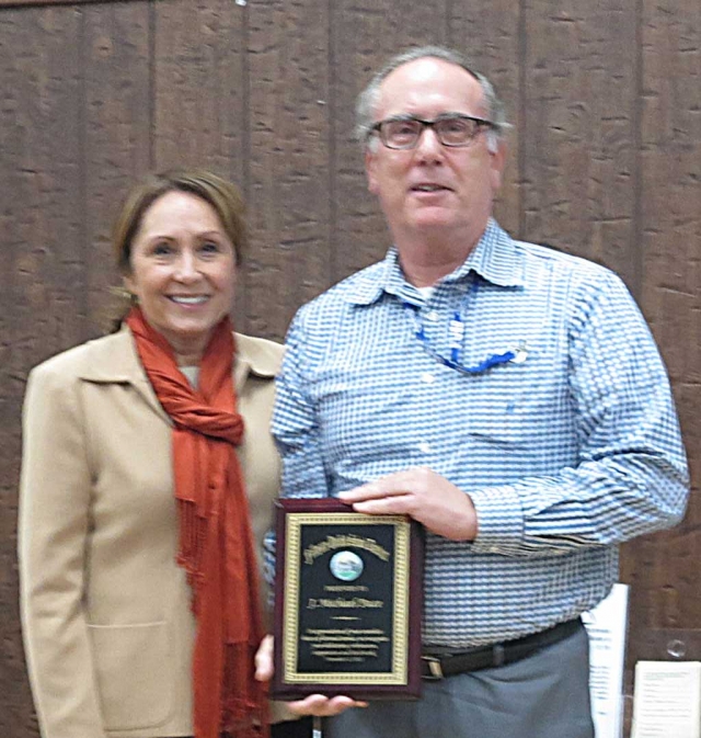 Mike Pace was recognized for his years of service to the Fillmore Unified School District. He will be leaving the district at the end of November. School Board President Virginia De la Piedra presented the plaque.