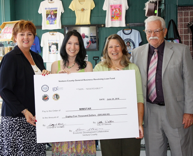 Pictured (l-r) Supervisor Kathy Long, Mimstar owner Karen Thayer, Fillmore Mayor Patti Walker, and Joe Palmer, EDC-VC loan officer, celebrate at the recent check-passing ceremony.