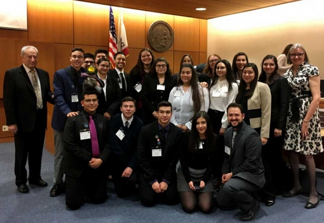 Back Row: Attorney Coach Gary Jacobs, freshman George Mooradian, junior Edgar Gonzalez, junior Damian Meza, sophomore Lilly Diaz, senior Alexander Ponce, freshman Olivia Palazuelos, junior Fatima Bazurto, freshman Melissa Tovar, freshman Montana Spangler, sophomore Isabella Palazuelos, senior Paulina Guerrero, senior Maria Elena Fernandez, coach Jacqueline Tovar, Captain senior Mishell Beylik, attorney coach Laura Bartels. Front row: senior Manuel Gutierrez, freshman Jorge Lizárraga, junior Jerry Tovar, senior Alina Herrera, Faculty /Attorney Coach Steven Geddes.