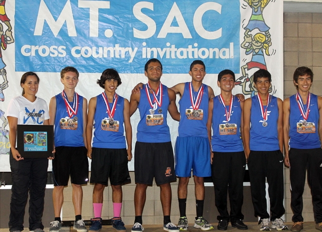 JV Boys National Championships (Division IV) (l-r) Ms. Tafoya, Justin Beach, Frank Chavez, David Enriquez, Jovani Oregon, Sammy Martinez, Mario Gaspar and Vincent Chavez.