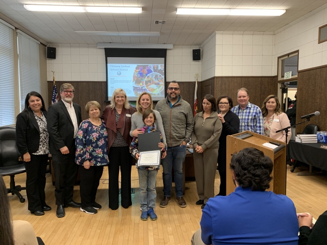 The FUSD Board Members recognized this year’s Indian Education Student of the Year and Retirees. Pictured above left are members along with Parker Blackshear, Mountain Vista 4th Grade Indian Education Student of the Year. Pictured above right board members along with the FUSD Retirees who received plaques in recognition of their dedication to FUSD. In no specific order with Doris Nichols: Art Teacher, Fillmore Middle School, 27 years; Jesus Garnica: Maintenance I, Maintenance Operations Transportation, 27 years; Debbie Tramel: Account Clerk II, District Office, 10 years; Vicki Murphy: Teacher, Mountain Vista Elementary, 41 years; and Manuel Halcon: HS Head Custodian, Fillmore High School, 37 years. 