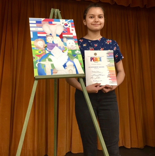 Rosalyn with her winning poster. It was announced at the recent Fillmore Lions Club Enchilada Dinner. Photo courtesy Brain Wilson.