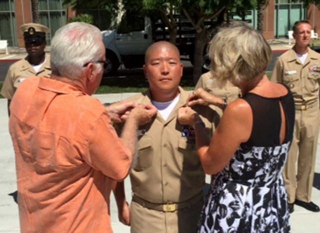 Proud parents Richard and Carolyn Diaz had the honor of pinning Chief Diaz’s Navy Chief Anchors to his
uniform.