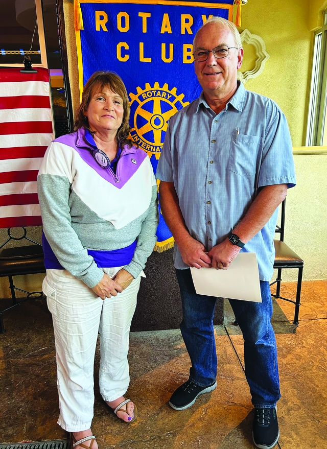At last week’s Rotary Club of Fillmore meeting, President Anna Reilley inducted new member Gary Cushing into the club. Photo Credit Martha Richardson.