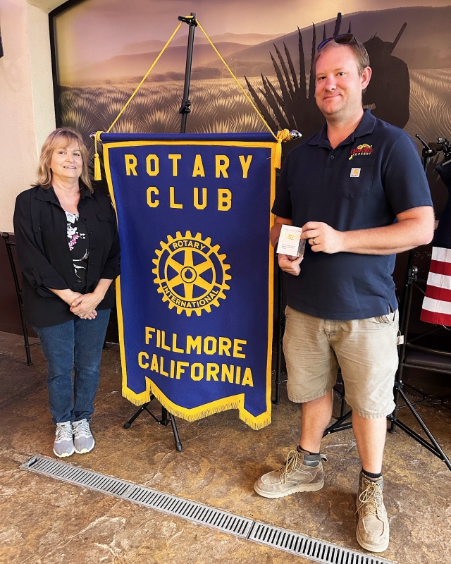At last week’s Fillmore Rotary Club meeting President Anna Reilley presented Rotarian Andy Klittich with a Rotarian of the Month pin for being the treasurer of the club. Photo credit Martha Richardson.