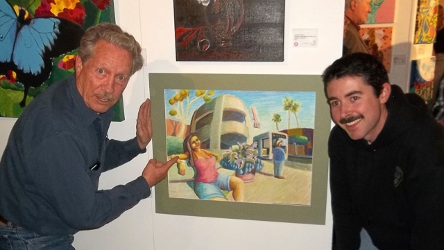 Juror Bob Privitt and Oxnard College student Danny Lawlor in front of Lawlor’s first-place winning artwork “Gold Coast Transit”. Photo credit: Florentino Bacoan