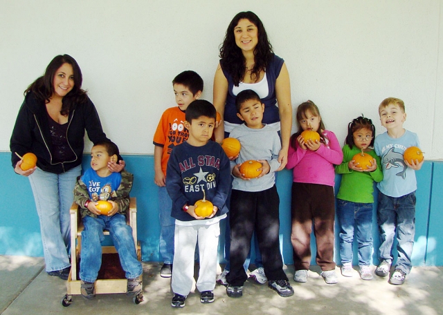 Ms. Morales’ kinder class holding their pumpkins from Faulkner Farms.