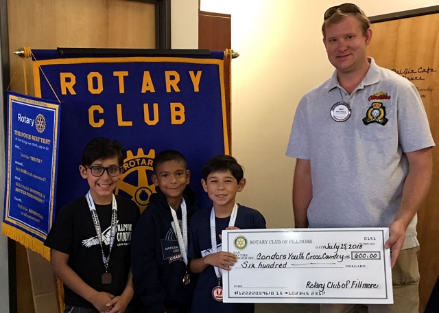 Pictured in no particular order are Diego Felix, Santiago Felix and Abel Arana from the Fillmore Condor Cross Country Team accepting a $600 check from the Fillmore Rotary Club presented by Club President Andy Klittich (far right), not only did the team place 2nd at the Heritage Valley 5K Run back in May, but the team also participated in the National Jr. Olympics, in Florida, in December of last year and did very well. Photo courtesy Martha Richardson.