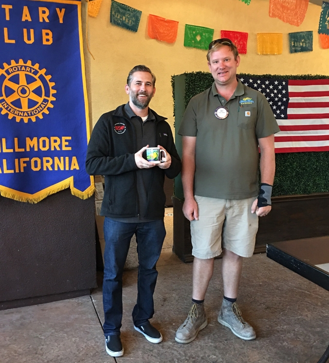 (l-r) Rhett Mauck with Rotary Club President Andy Klittich after speaking to the group last week. Mauck is
the Director of Development of Search Dog Foundation, founded by Wilma Melville. She and her FEMA certified search dog were deployed to the Oklahoma City bombing site where only one survivor was found by the dog. It was then she realized there was a severe shortage of search dogs, so she founded this Foundation in 1996. It is a nonprofit, non-governmental organization based in Santa Paula. The purpose is to strengthen disaster response by producing highly skilled canine disaster search teams to search for missing persons and victims of natural and man-made disasters. Canine recruitment is from rescued dogs which are tested and trained. If the dogs are exceptional, they will train from 8 to 12 months, then partner with a first responder and train together to receive certification for deployment. Dogs who do not complete the training are placed in another career or adopted into a “fur-ever” home. Healthcare needs are given to all active and retired dogs for the remainder of their lives. [Courtesy Rotary Club member Martha Richardson]