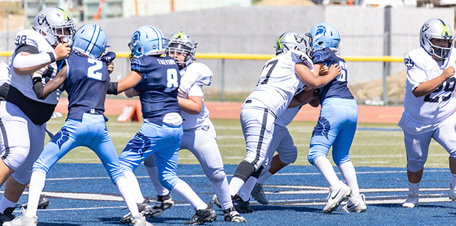 Above, Raiders Sophomores face the Saugus Spartans as the defensive line stops the Spartans’ offense from advancing. The Raiders defeated Saugus 14–8. Photo credit Crystal Gurrola.