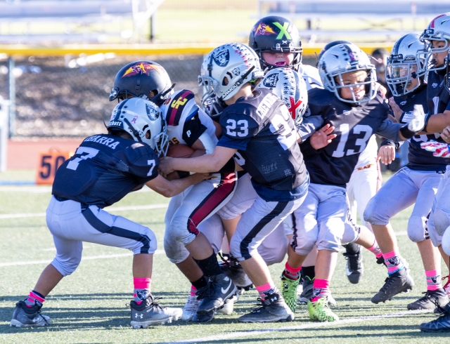 On Saturday, October 19, Raiders Bantam Silver took on the Santa Clarita Warriors. Above is Raiders #7 and #23 tackling a Warriors player; final score Fillmore 14–6, Santa Clarita. Photo credit Crystal Gurrola. 