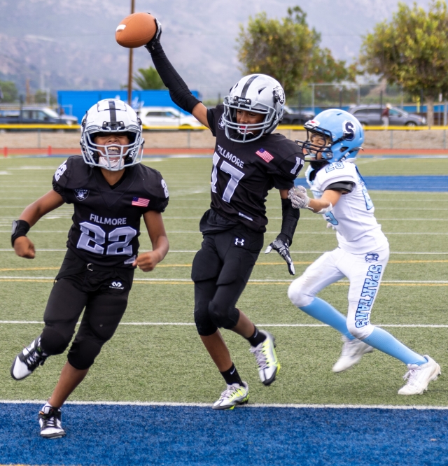 Raiders Sophomores celebrate as #17 scores a touchdown for the team in Saturday’s game against Saugus White. Photo credit Crystal Gurrola.