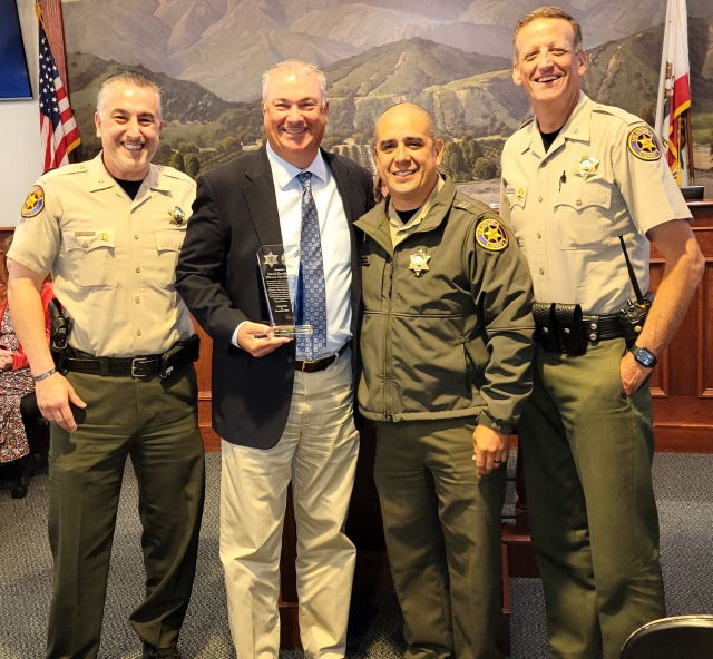Picture (l-r) are Garo Kuredjian, City Manager Dave Rowlands, Eduardo Malagon, and Eric Tennessen as they recognize and thank Rowlands for his years of service to the city and community.