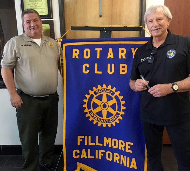 Fillmore Rotary Club President Dave Warham (left) presented Fillmore Building Inspector Michael Koroknay with a Rotary mug after his presentation about the Earthquake Brace & Bolt program. He discussed home foundations and what could happen during an earthquake. He informed the Club that homeowners can receive up to $3,000 toward an earthquake retrofit. The program is Earthquake Brace & Bolt and the timeline to apply is January 23-Feburay 23, 2018. Photo courtesy Martha Richardson.