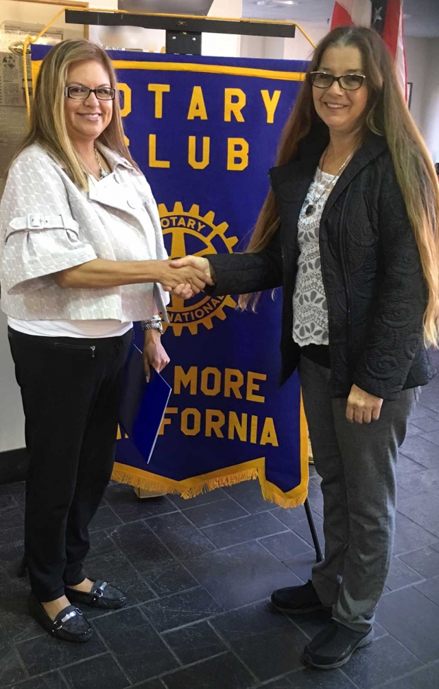 The newest member to the Rotary Club of Fillmore is Ari Larson inducted by President Julie Latshaw