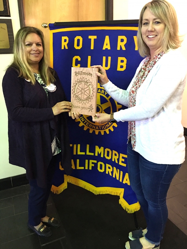 Rotary President Elect Ari Larson receives a beautiful, machine carved plaque from the FHS Robotics Team presented by Rotation Lisa Cook. They placed 29th out of 43 teams in a recent competition. The Rotary Club had made a donation to FHS Robotics Club. Courtesy Martha Richardson.