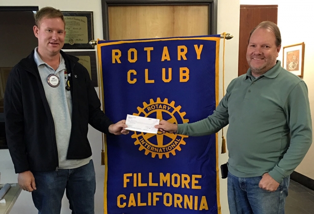 Fillmore Rotary Club donated $500 to the Fillmore Fire Foundation. Scott Beylik accepted the check from Rotary president Andy Klittich. Photo courtesy Martha Richardson.