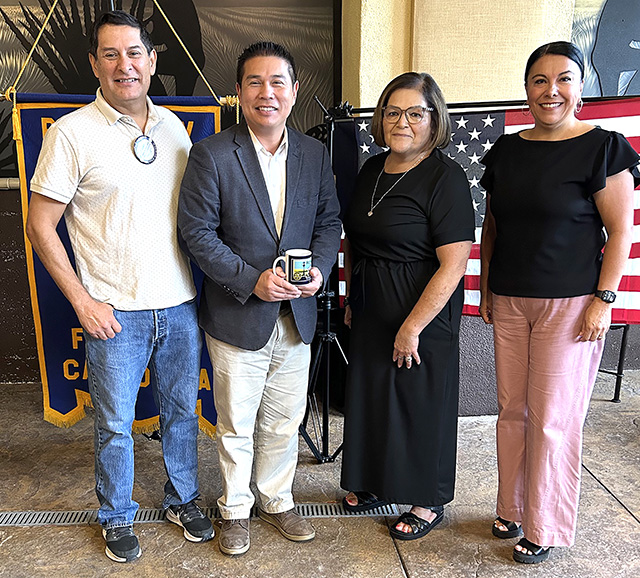 Pictured (l-r) are President John Garnica, speaker Isaac Huang, Board President Olivia Palacio and Rotarian Chrissy Schieferle. Photo credit Martha Richardson.