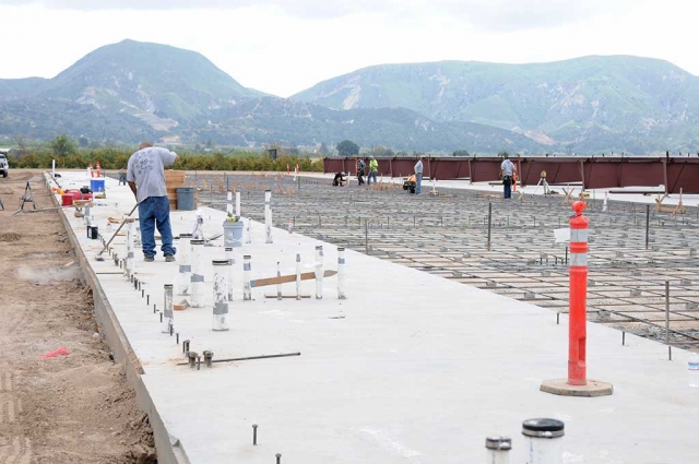 Rotorcraft Support Inc. and The Guardian have made progress on the new private heliport, maintenance and repair facility for helicopters being built at the southwest corner of River and D Streets. Crews were seen this past week pouring concrete and setting steel poles all along the area.