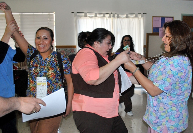 Fillmore Convalescent Center staff congratulat one another on their START Triage completion.