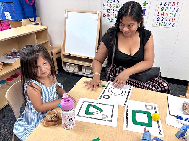 Students at San Cayetano Preschool collaborated with their parents to create shapes. This helps students to expand their language and build fine motor strength through the manipulating of Play-Dough. Parent meetings are held once a month in order to connect with teachers and learn about what is to come in the classroom. This also serves as an opportunity for parents and their children to bond in an educational way while allowing families to collaborate with one another and build a strong educational community. Posted July 24, 2026, at 4:25pm courtesy https://www.facebook.com/photo/?fbid = 122256583250147053&set=pcb.122256583322147053.