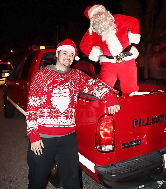 On Sunday, December 14, Santa was escorted by his helpers the Fillmore Patrol Deputies and Fillmore Fire Department through the street of Fillmore spreading Christmas Cheer giving gifts to children in Fillmore who were very good this year. Pictured is some of the fun they had riding through town spreading Christmas cheer. Photo credit Angel Esquivel.