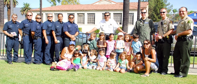 Friday, September 11, Sonshine Preschool held a 911 remembrance for the local heroes. Pictured above are Fillmore Fire Department and local law enforcement, with children.