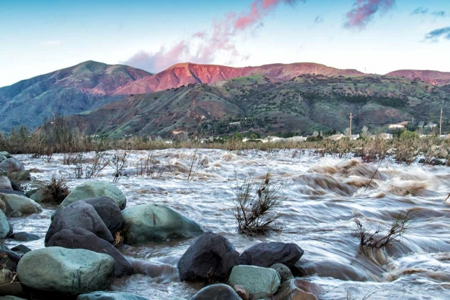 Photo of the Week: Sespe Creek after the triple rain storms a week ago. Though could have been shot various ways, my 'artistic' intent was to shoot at sundown for some warm color on the hilltop. Notice the bushes in the creek are all sharp while the water is blurry? I set the camera mode dial to shutter priority. Image particulars: lens at 24mm, aperture at f/10, shutter speed 1/15 sec., ISO 500. (Mighty Trinity of Exposure) Camera handheld, not tripod mounted. To include some foreground, perspective, I shot the photo from the water's edge. Questions/comments welcome.
