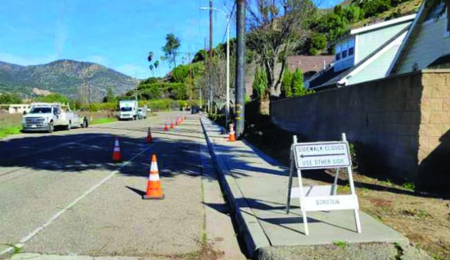 On Saturday, January 24, at 7:40am, work crews were on Goodenough Road near the Tradition housing track. The sidewalk was blocked off while they made repairs to the area near the new power poles, which were replaced recently. 