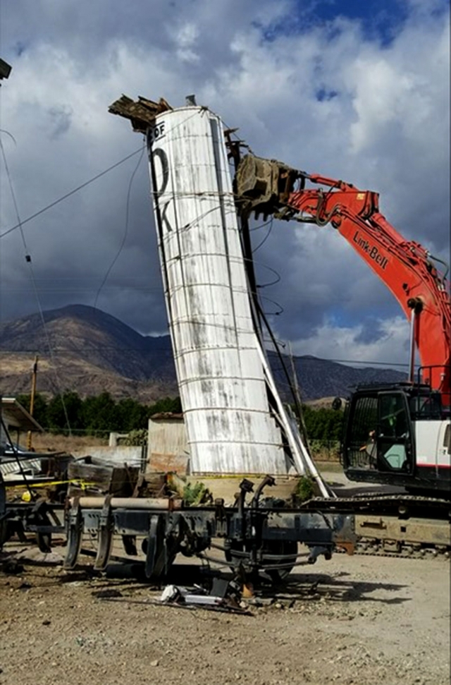 Last week the Santa Ana winds came through Fillmore in full force and caused damages to the historic landmark Sanitary Dairy silo that sits on Old Telegraph Road. (above) Crews taking down the silo after the winds passed.