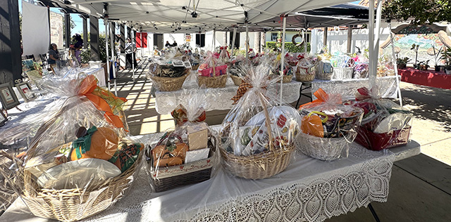 The St. Francis of Assisi Roman Catholic Church Festival was held on Sunday, October 4, 2026, and they went all out! The popular silent auction offered dozens of treat-filled baskets, pictured above. The Blessing of the Animals draws all kinds of critters, including turkeys, pictured below. The annual ticket raffle/lottery was held, with the big prize of $2,000. The Stations of the Cross tractor ride was a fun addition, along with a Bounce House. Live music, games and great food and drink rounded out the fun-filled day. Photo credit Gazette staff.