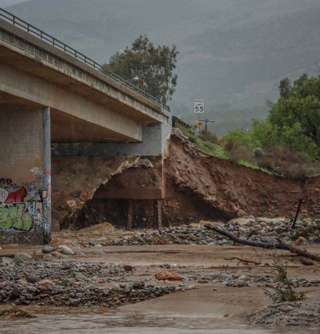 Old Telegraph Road is now closed between C Street and Grand Avenue while County Public Works assesses possible structural damage to the vehicle bridge. According to Ventura County Public works, “Severe washout under abutments on west end of Bridge No. 487. Emergency O&M response. To be assessed by DAT Team after rain event.” The bridge was closed on Monday, February 5th, at 9:30am, until further notice. Photo credit Angel Esquivel-AE News.