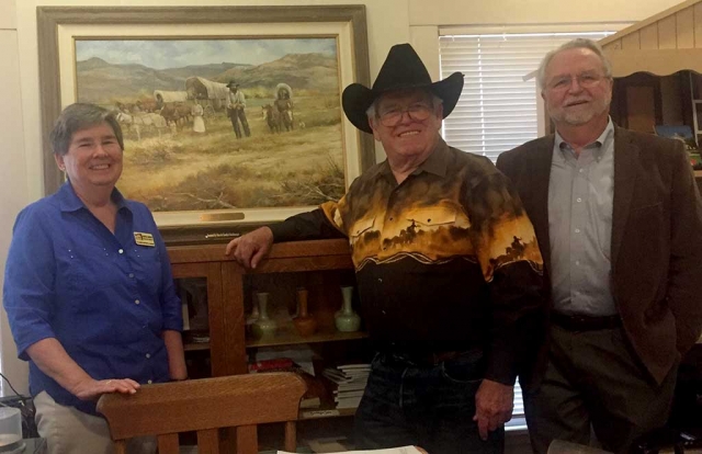 On Friday, May 18th the Fillmore Historical Museum received an oil painting courtesy of the Goodenough family. Left to right: Museum Executive Director Martha Gentry, Artist Bob Rickards, and Donor Russ Goodenough. Photo courtesy Martha Gentry.
