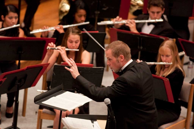 Michael Hart directing the Cal Lutheran Wind Ensemble. Photo credit: Brian Stethem