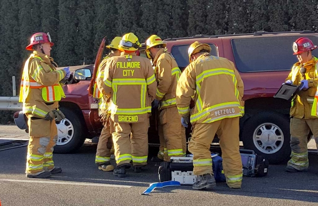 Fillmore Fire gather to help extract a victim from on of the vehicles.