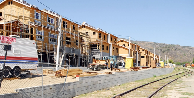 The Central Station Townhouses project appears to be more than half finished. The threestory complex is crowded against the railroad tracks, with a single, narrow entry, much to the chagrin of those who opposed the plan for poor location and high density.