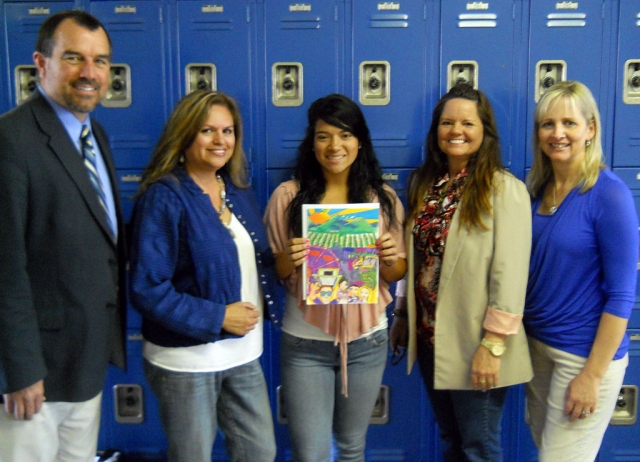 The artwork will be on the tshirts/posters. In the photo: High School Principal John Wilber, High School Student/Winner Amanda Vassaur, Ari Larson 1st VP Chamber, Cindy Jackson President of Chamber, Tammy Hobson, 2nd VP of Chamber. Amanda will also receive a pass to enter in the festival all four days, carnival rides and a backstage pass to meet the SOS Band on Saturday night.