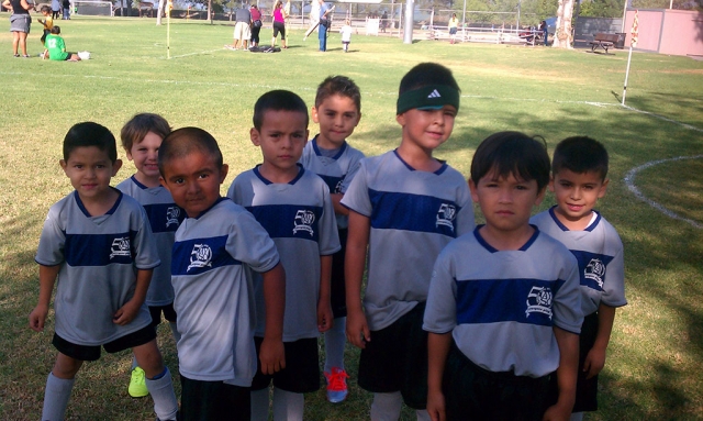 The U-6 blue ninjas boys getting ready for the start of the soccer game.