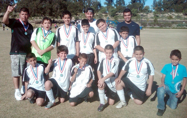 Congratulations to FILLMORE AYSO WHITE TIGERS U-12 team for winning the Championship this weekend defeating Santa Barbara 7-2. They will now go to Bakersfield to represent Ventura/Santa Barbara County in February 2011. Top Row: Coach Shorty Andrade, Anthony Cervantes, Issac Torres, Alex Mendoza, Coach Ernie Alcaraz, Jose Alamillo, Luis Salgado, Coach Andy Diaz. Bottom Row: Christian Andrade, Christian Rosales, Angel Velez, Andy Arana, Jess Ballesteros and Jairo Rios. Way to go Boys!!!