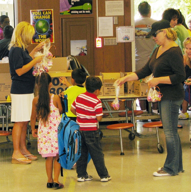 The backpacks, filled with supplies, were donated by Support for the Kids Foundation, organized by Linda Miller.