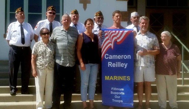 A military banner installation was held on Tuesday, July 5th in front of the Fillmore Unified School District office at 3pm. Cameron Reilley, a Lance Corporal in the U.S. Marine Corps, received a banner. Cameron is pictured with his mother Lindy Reilley, at his right and his father John Reilley on his left. His grandparents (left) are Judy and Lin Thomas; grandmother pictured right is Flori Reilley. At back are VFW Post 9637 members Vic Westerberg, Jim Mills, Jim Rogers, Ismael Alonzo and Tom Ivey. His siblings Brande Wade, Andrew Reilley and Grace Reilley were also at the installation.