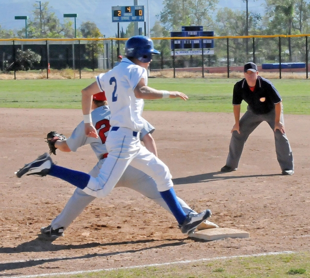 Corey Cole #2 beats the throw to first base.