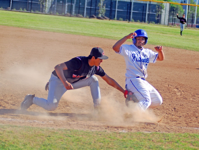 Sal Ibarra gets safely to first base before Carpinteria's first baseman tags him.