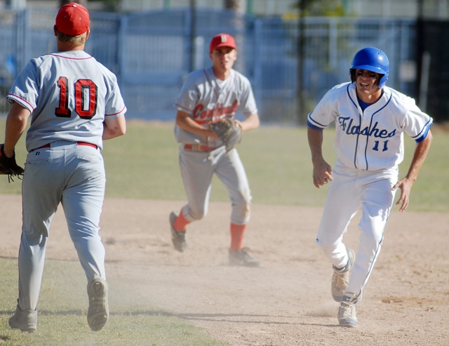 Quinn Keller gets caught in a run down between first and second base. After several throws back and fourth Keller successfully steals second and on the next pitch steals third. Fillmore lost to Bishop Diego 5-2.