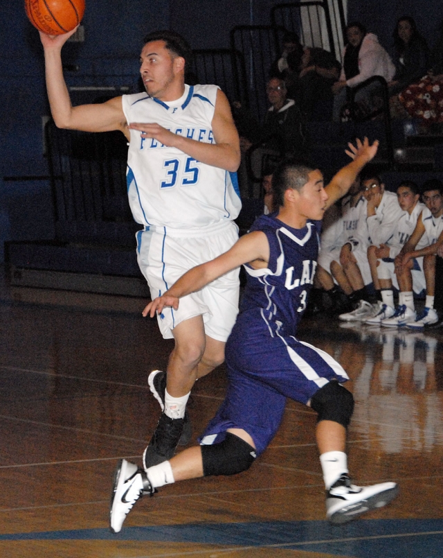 Chris DeLaPaz passes the ball to a teammate. Fillmore played LA Baptist last Wednesday, January 5. DeLaPaz had 6 assists and 7 rebounds.