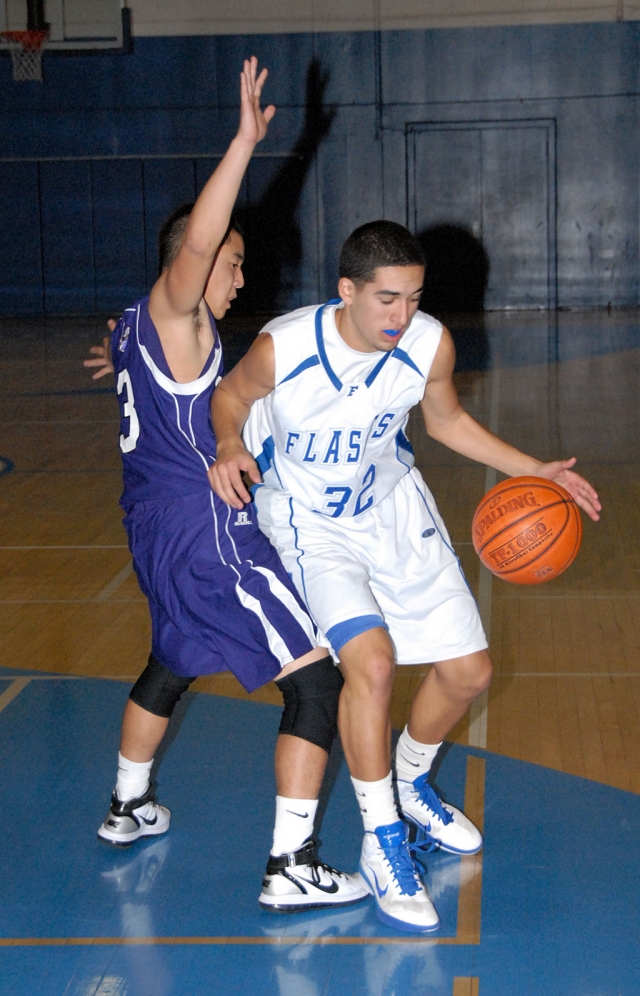 Nathan Zavala #32 dribbles around his opponent.