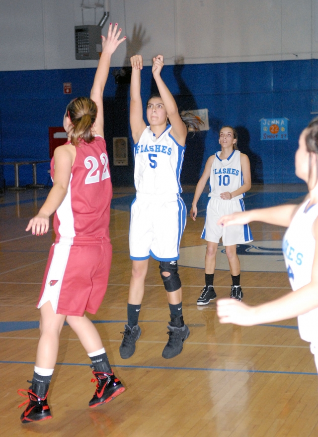 Ashley Coert #5 jumps above Bishop Diego’s defense for a three point shot.